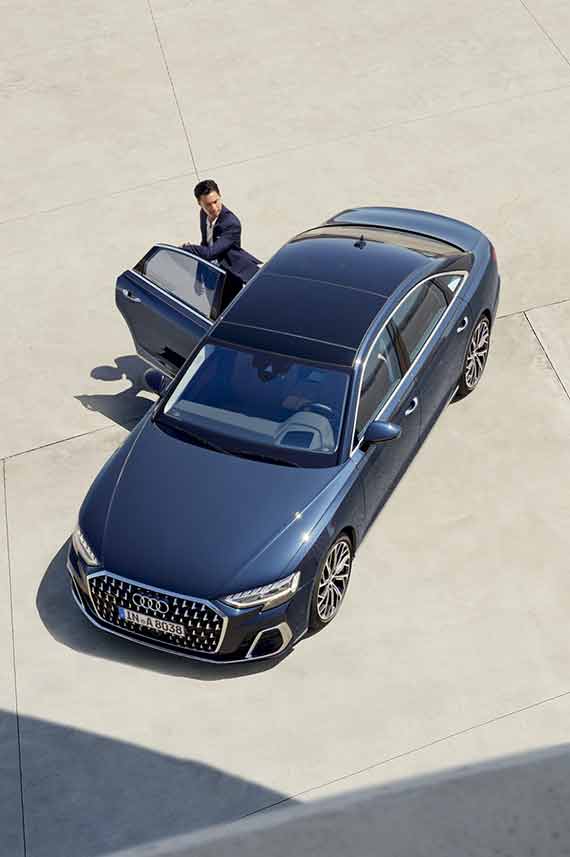 top view of Audi A8 L with a man coming out of the rear door